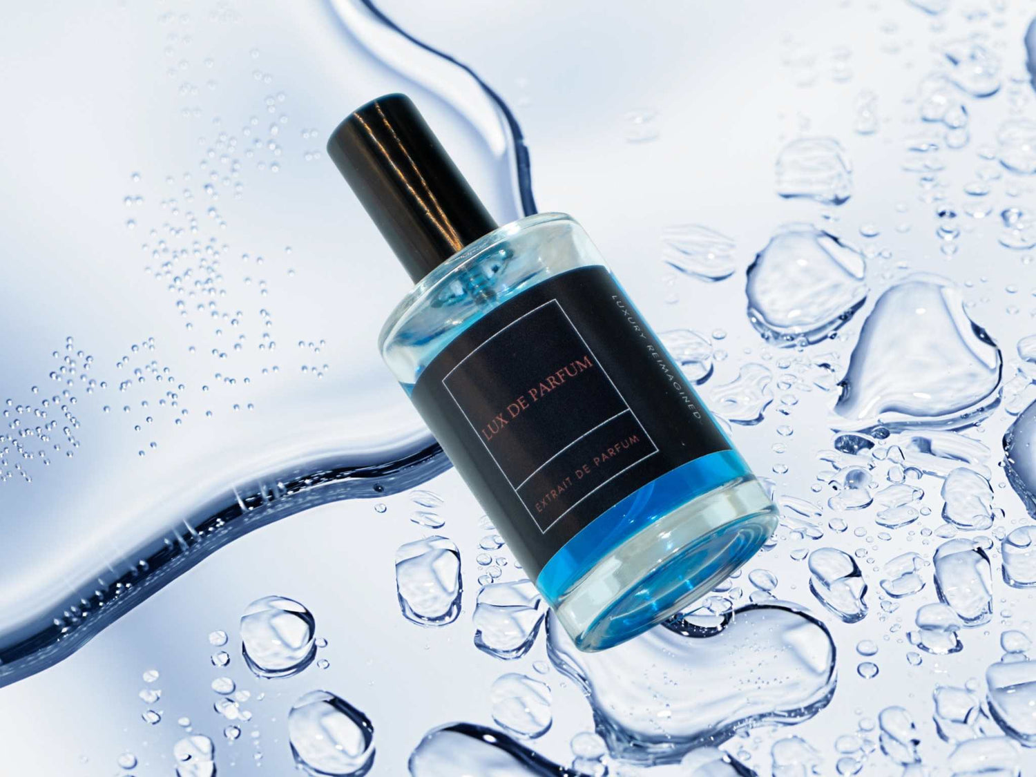 Silver Dune Springs premium 100 ml fragrance bottle with blue liquid on icy water surface