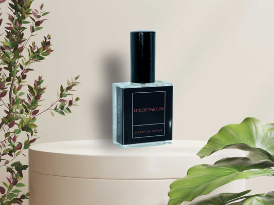 Timber Oud 100 ml premium fragrance bottle with black label on white round pedestal surrounded by green plants